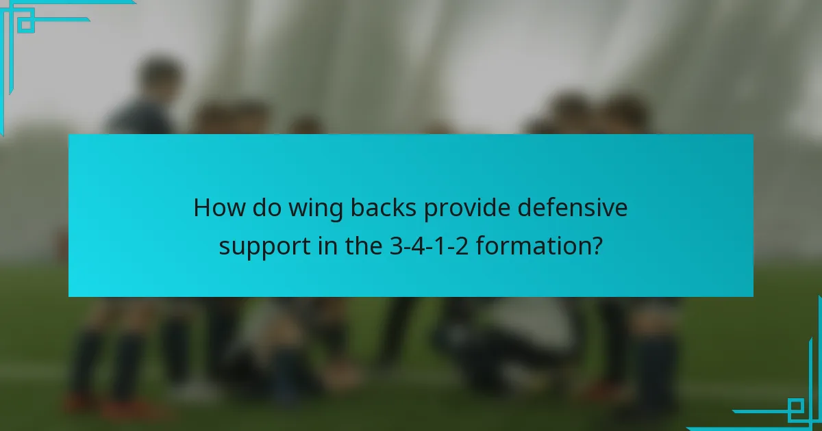 How do wing backs provide defensive support in the 3-4-1-2 formation?