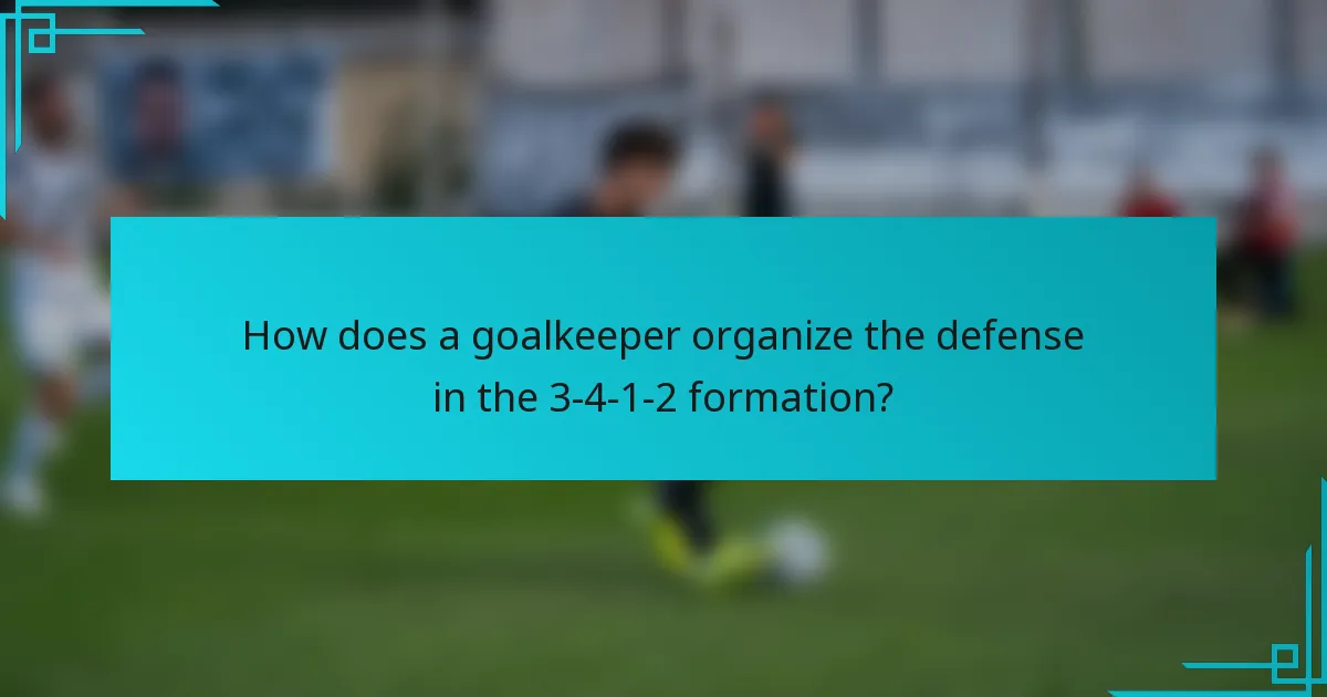 How does a goalkeeper organize the defense in the 3-4-1-2 formation?